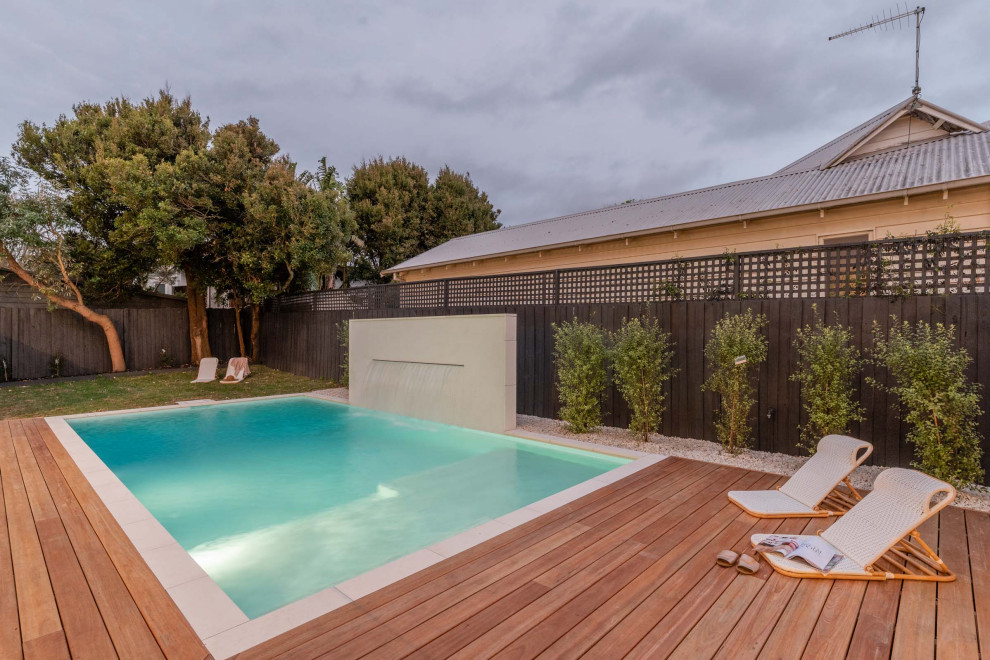 Design ideas for a beach style pool in Melbourne.