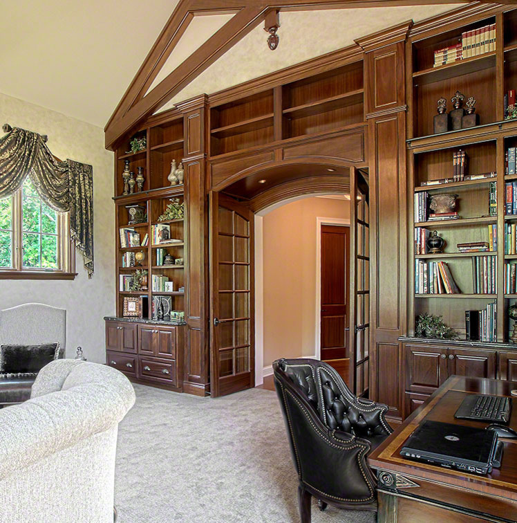 Photo of a large traditional home office in Dallas with carpet, a standard fireplace, a stone fireplace surround, a freestanding desk and white floor.
