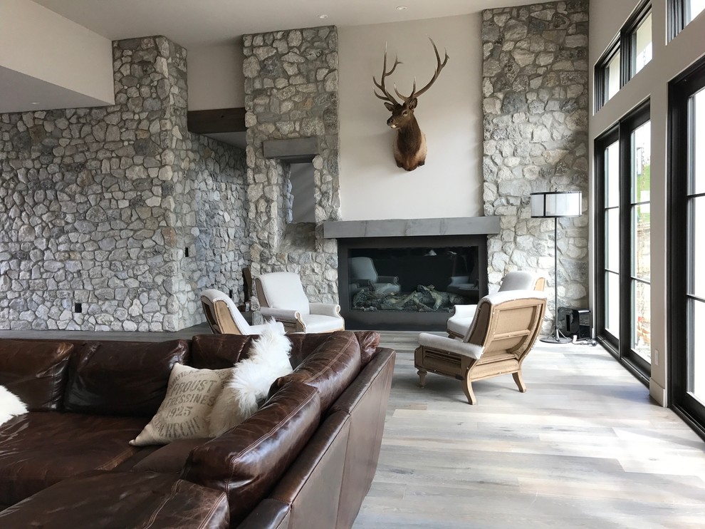 Inspiration for a large transitional formal open concept living room in Sacramento with grey walls, light hardwood floors, a standard fireplace, a metal fireplace surround, no tv and beige floor.