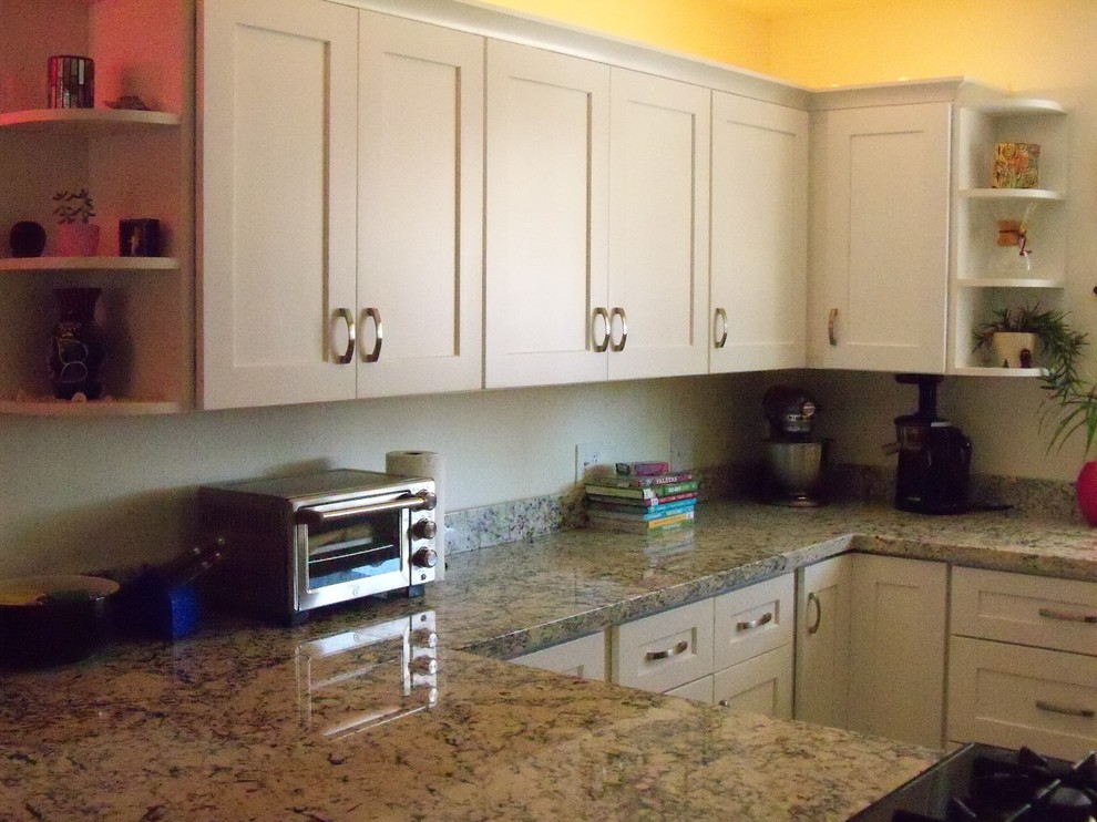 Inspiration for a small transitional u-shaped eat-in kitchen remodel in Phoenix with a single-bowl sink, shaker cabinets, white cabinets, granite countertops and a peninsula