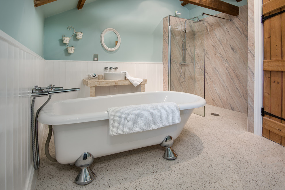 Mid-sized beach style kids wet room bathroom in Other with blue walls, linoleum floors, a vessel sink, beige floor, an open shower, a claw-foot tub and stone slab.