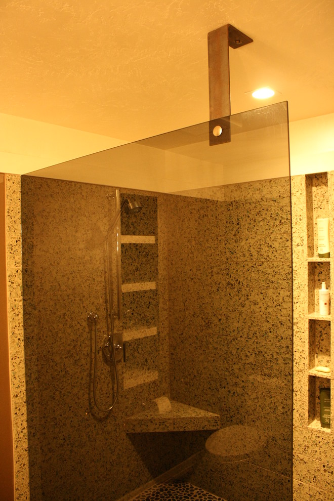 Example of a black tile cork floor doorless shower design in Milwaukee with an integrated sink, open cabinets and concrete countertops