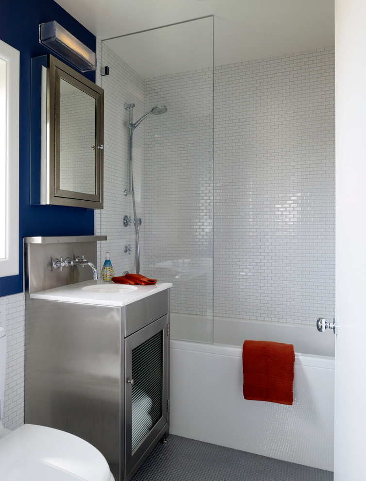 Contemporary bathroom in San Francisco with an undermount sink, glass-front cabinets, an alcove tub, a shower/bathtub combo and white tile.