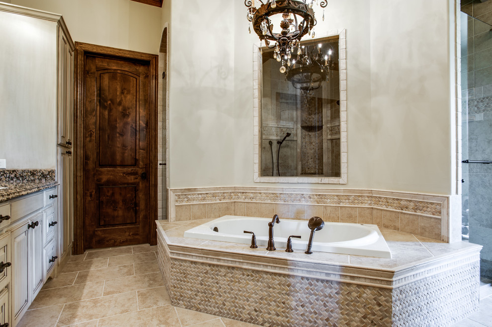 Large traditional master bathroom in Dallas with a hot tub.