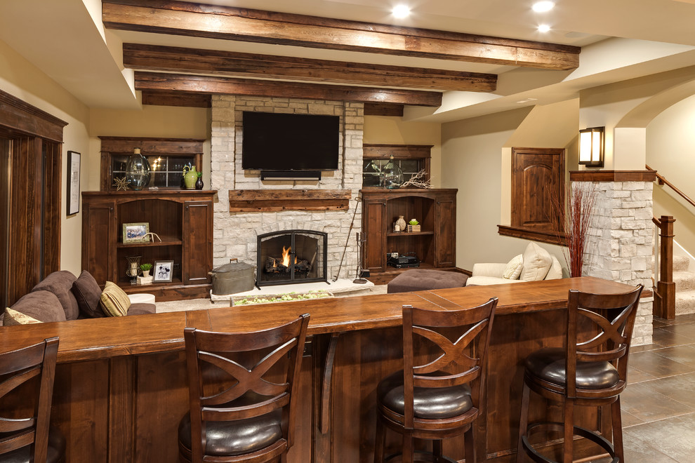 Inspiration for a large traditional walk-out basement in Chicago with beige walls, porcelain floors, a standard fireplace, a stone fireplace surround and brown floor.