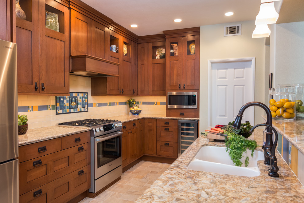 Mid-sized arts and crafts kitchen in Los Angeles with an undermount sink, shaker cabinets, medium wood cabinets, multi-coloured splashback, stainless steel appliances, a peninsula, beige floor and subway tile splashback.