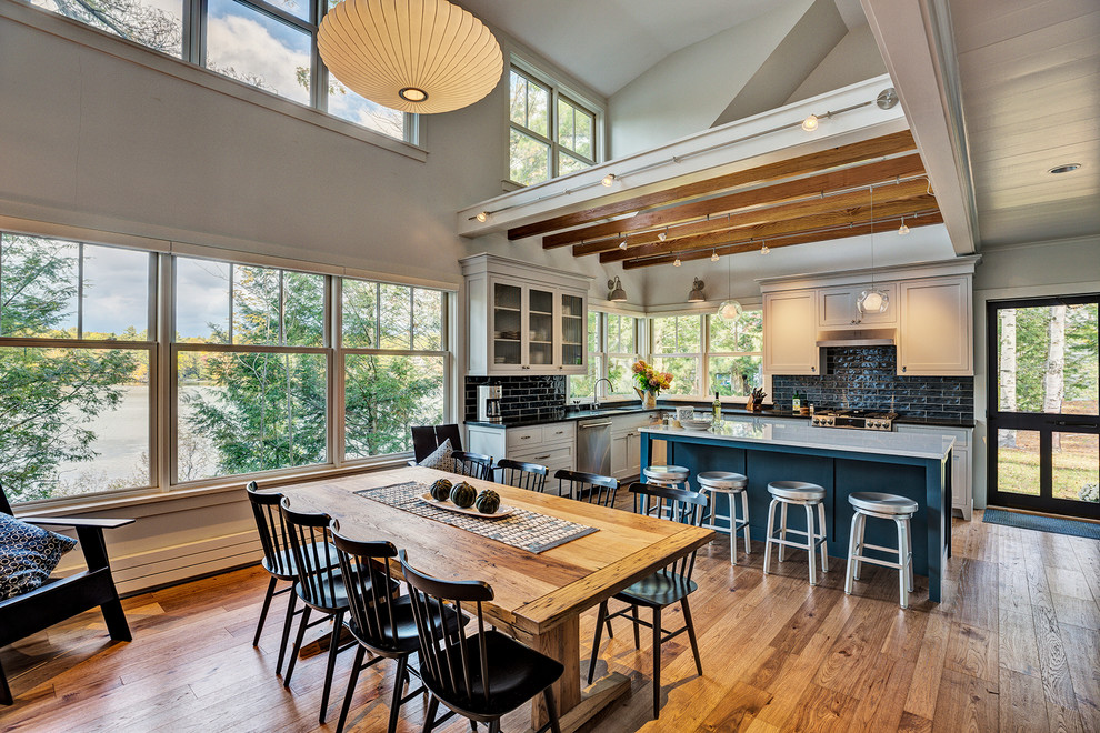 Design ideas for a beach style kitchen/dining combo in Burlington with medium hardwood floors.