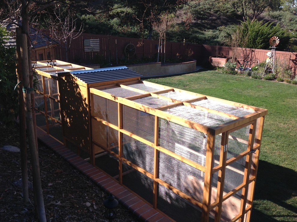 Large transitional backyard full sun garden in Orange County with a vertical garden.