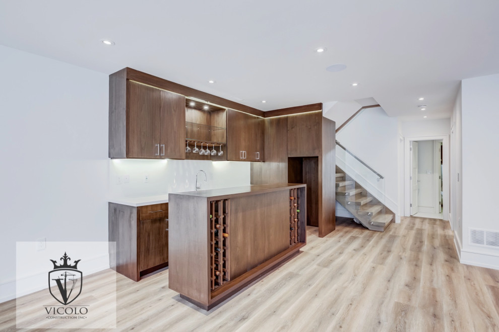 Example of a mid-sized transitional walk-out laminate floor and brown floor basement design with white walls, a hanging fireplace and a tile fireplace