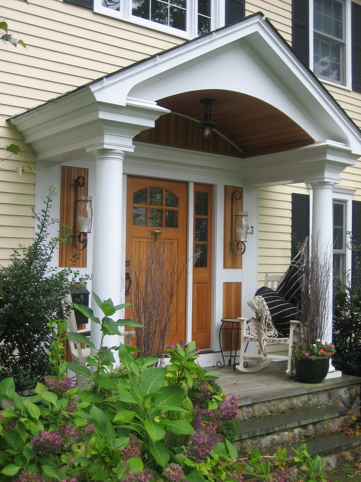 Design ideas for an arts and crafts front door in Boston with a single front door and a medium wood front door.