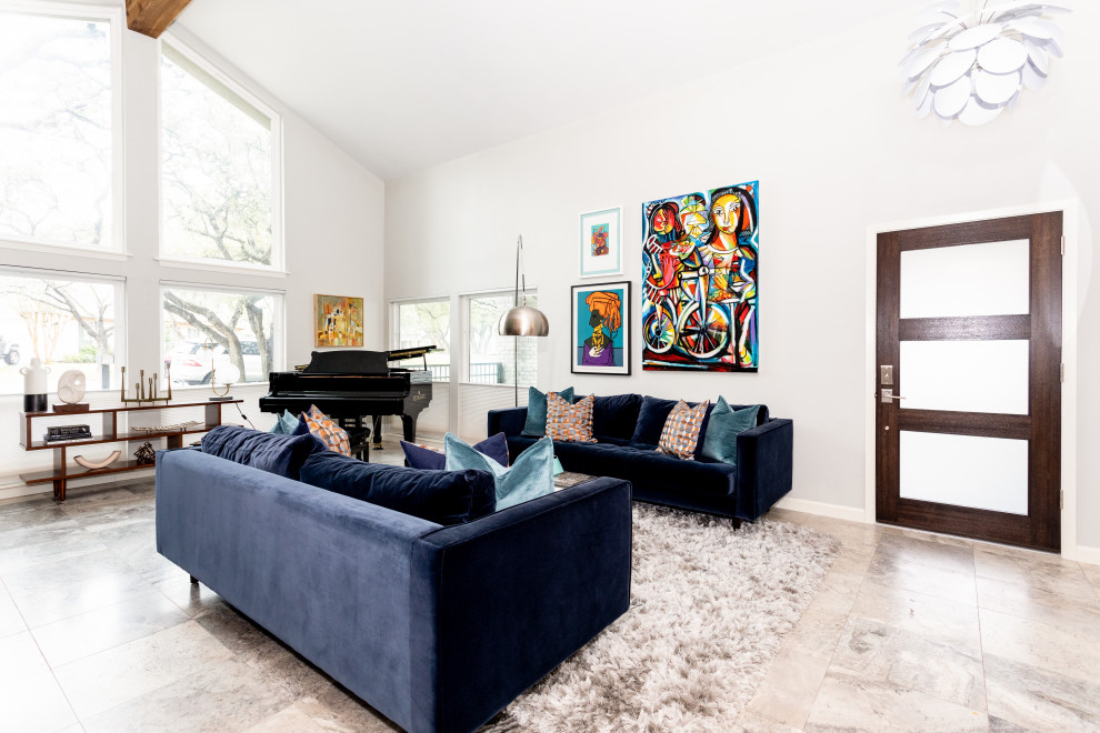This is an example of a contemporary open concept living room in Austin with a music area, white walls, no fireplace, no tv, multi-coloured floor and vaulted.
