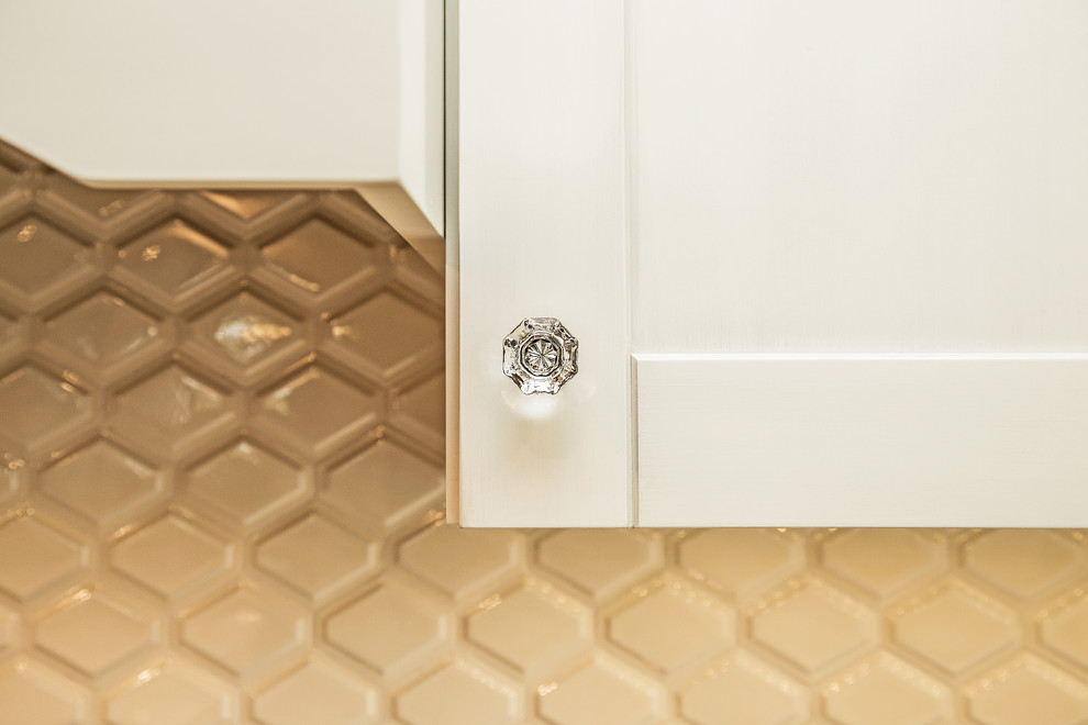 Inspiration for a transitional medium tone wood floor kitchen remodel in Calgary with an undermount sink, shaker cabinets, white cabinets, quartz countertops, white backsplash, porcelain backsplash and stainless steel appliances
