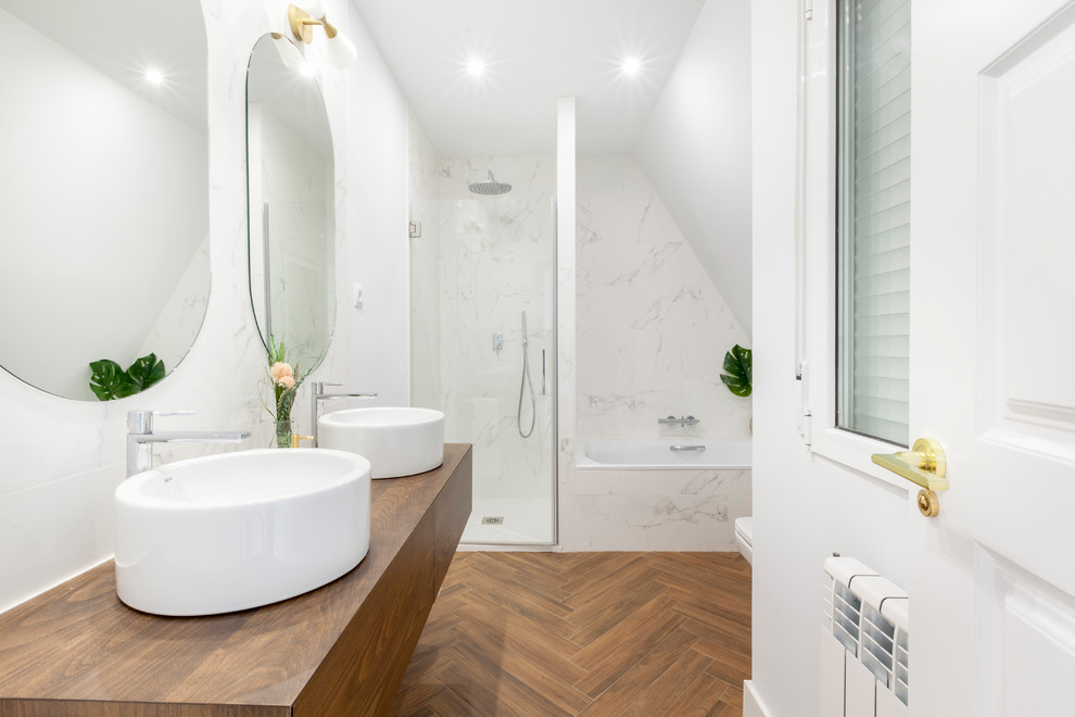 Contemporary bathroom in Other with flat-panel cabinets, medium wood cabinets, an alcove tub, an alcove shower, white tile, white walls, a vessel sink, wood benchtops, brown floor, a hinged shower door and brown benchtops.
