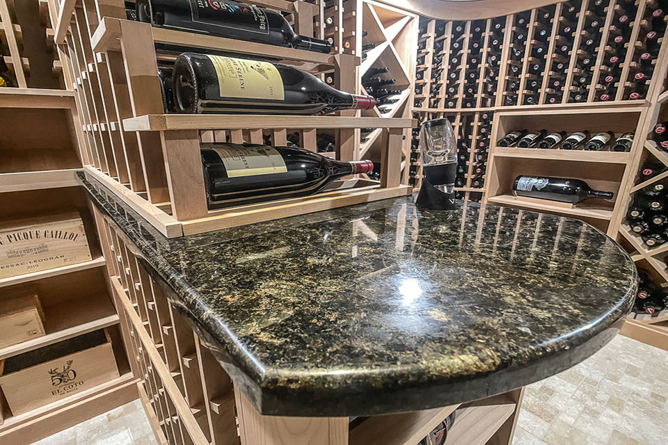 Design ideas for a mid-sized transitional wine cellar in Other with travertine floors, storage racks and beige floor.
