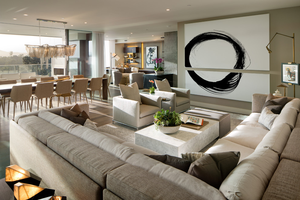 Contemporary open concept living room in San Diego with grey walls, dark hardwood floors and brown floor.