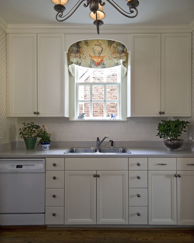 Photo of a traditional kitchen in Richmond with white appliances.