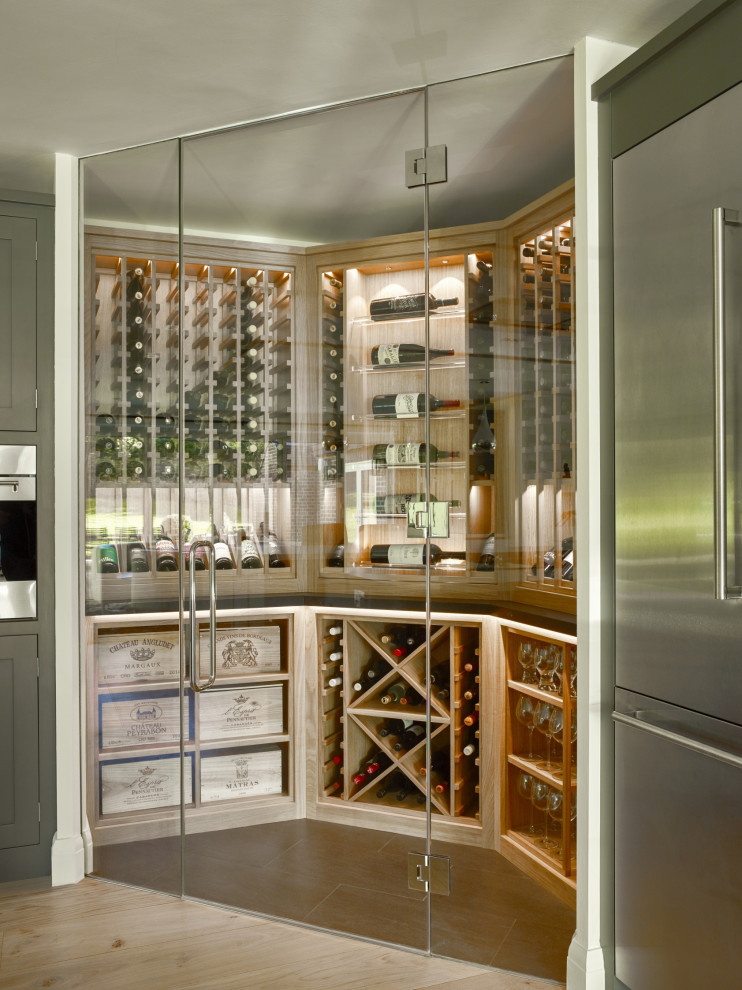 Photo of an expansive industrial wine cellar in Sussex with display racks.