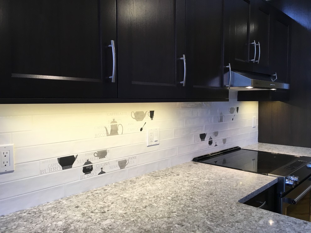 Example of a transitional kitchen design in Calgary