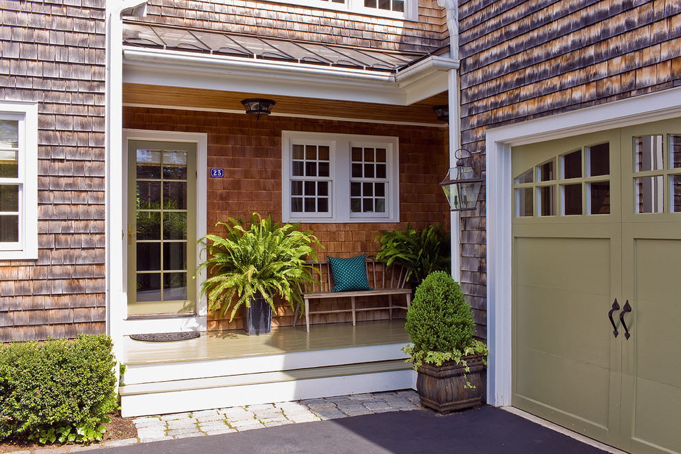 Design ideas for a transitional entryway in Boston with a green front door.