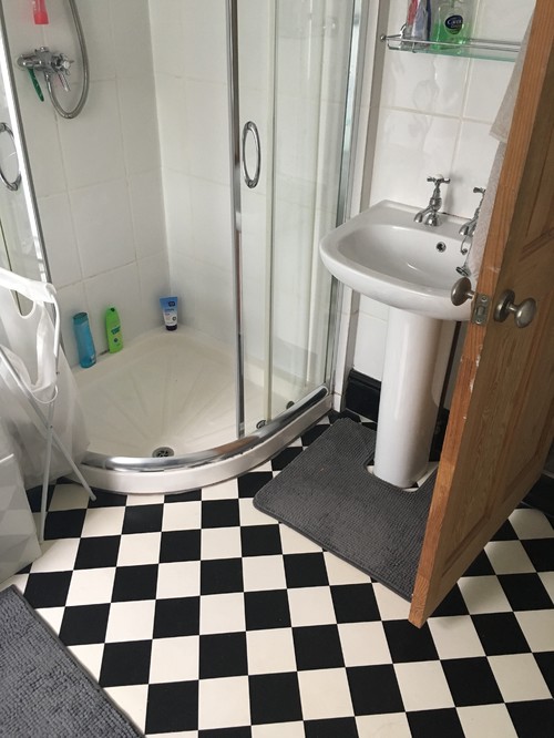 Black grout with large white tiles?