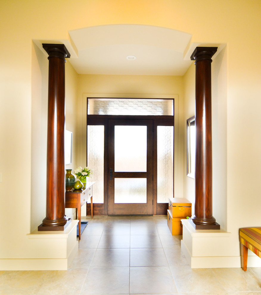 This is an example of a large contemporary foyer in Other with yellow walls, ceramic floors, a single front door and a dark wood front door.