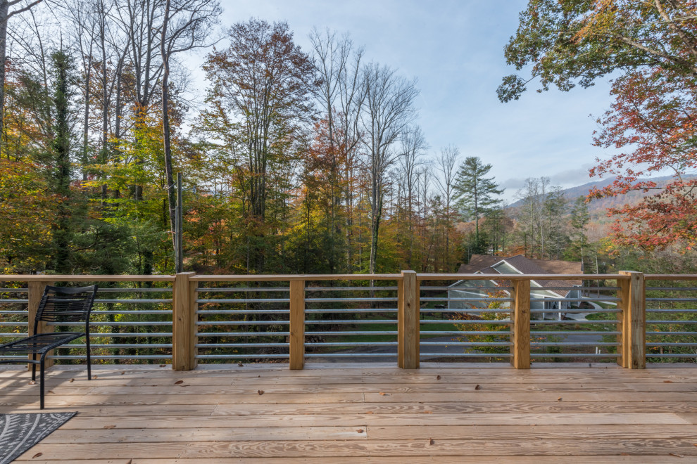 Mid-sized transitional backyard deck photo with no cover
