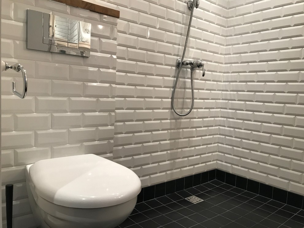 Photo of a small scandinavian master bathroom in Saint Petersburg with flat-panel cabinets, white cabinets, an open shower, a wall-mount toilet, white tile, porcelain tile, white walls, porcelain floors, a console sink, black floor and a shower curtain.