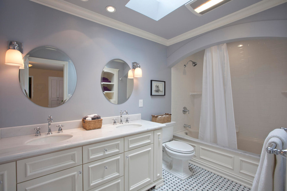 This is an example of a large traditional master bathroom in San Francisco with recessed-panel cabinets, white cabinets, an alcove tub, a shower/bathtub combo, a two-piece toilet, white tile, subway tile, purple walls, porcelain floors, an undermount sink and engineered quartz benchtops.