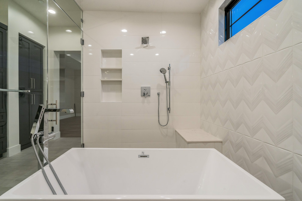 Master double-sink and shiplap wall freestanding bathtub photo in Phoenix with a floating vanity