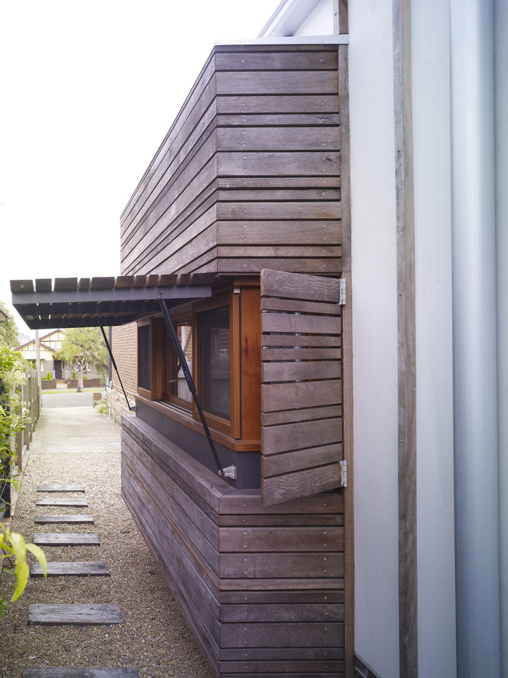 This is an example of a contemporary exterior in Sydney with wood siding.