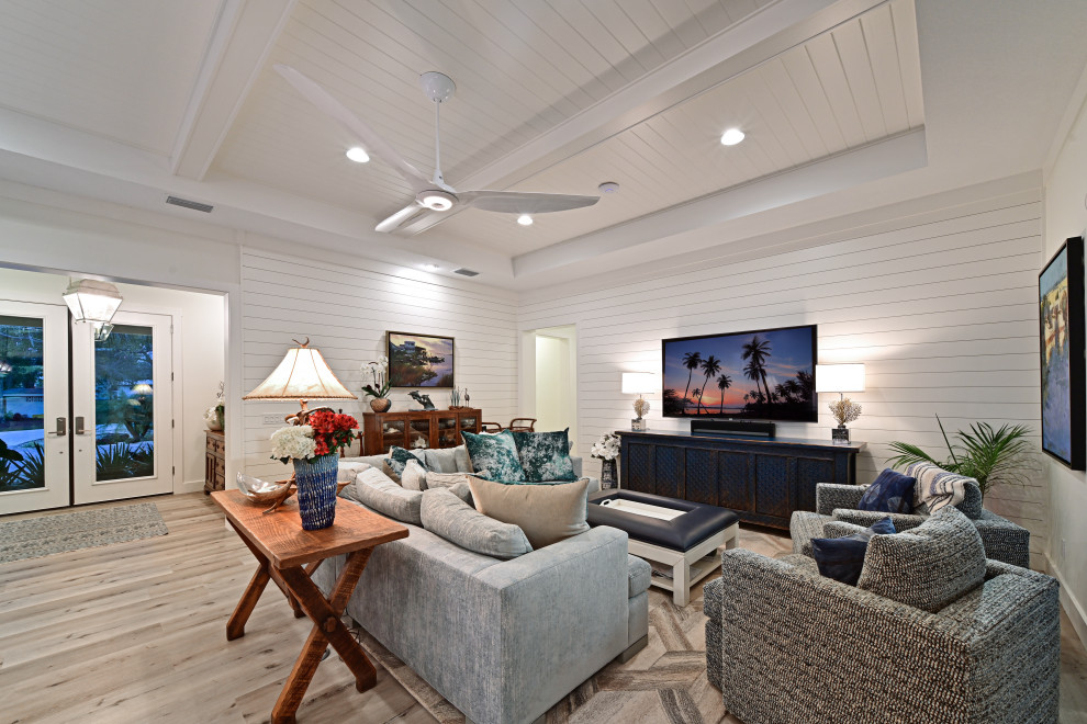 Photo of a beach style family room in Tampa.