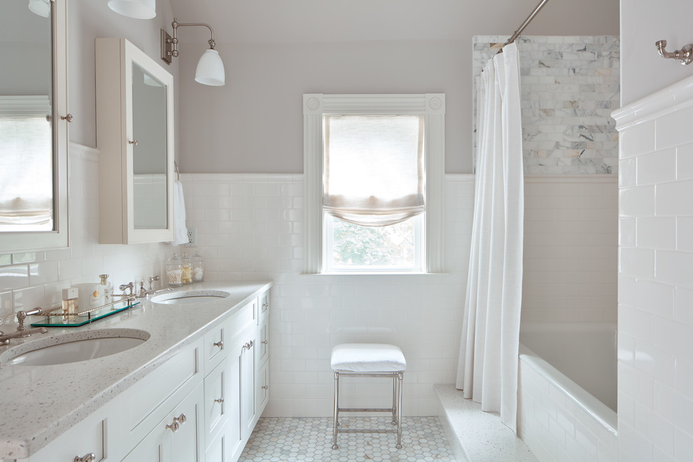 Photo of a mid-sized traditional master bathroom in Boston with shaker cabinets, white cabinets, an alcove tub, a shower/bathtub combo, white tile, subway tile, grey walls, marble floors, an undermount sink, engineered quartz benchtops, white floor and a shower curtain.