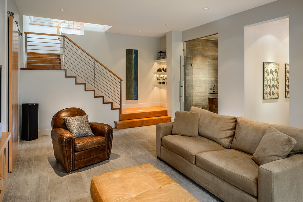 This is an example of a contemporary family room in Vancouver with beige walls.