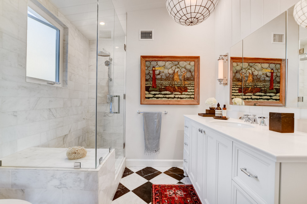 Photo of a mid-sized transitional master bathroom in San Diego with white cabinets, a one-piece toilet, gray tile, marble, white walls, marble floors, an undermount sink, quartzite benchtops, a hinged shower door, white benchtops, a shower seat, a single vanity, a freestanding vanity, timber, vaulted, planked wall panelling, recessed-panel cabinets and multi-coloured floor.