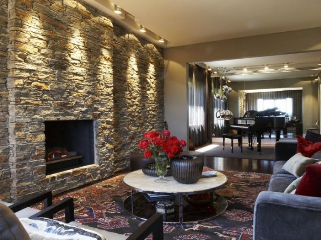 Vaucluse House with NZ Feature Schist Stone Wall and Fireplace eclectic-living-room