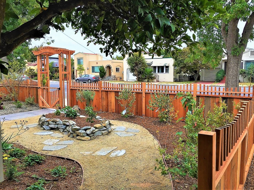 This is an example of a mid-sized front yard garden path.