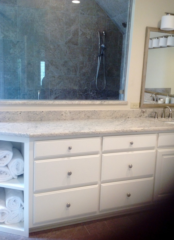 Large transitional master bathroom in Other with an undermount sink, a drop-in tub, an alcove shower, a two-piece toilet, raised-panel cabinets, white cabinets, granite benchtops, beige tile, porcelain tile, beige walls and porcelain floors.