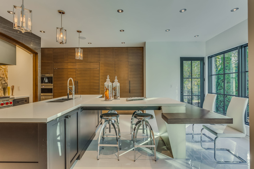Mid-sized transitional single-wall porcelain tile and white floor enclosed kitchen photo in Toronto with a double-bowl sink, flat-panel cabinets, medium tone wood cabinets, granite countertops, beige backsplash, stone tile backsplash, stainless steel appliances and an island