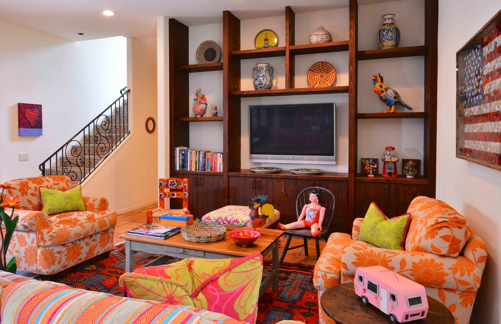 This is an example of a large eclectic kids' playroom for kids 4-10 years old and girls in Houston with white walls, terra-cotta floors and red floor.