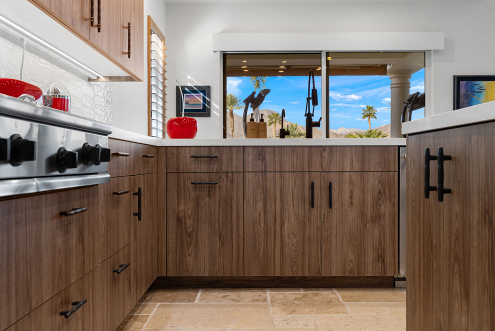 Inspiration for a rustic l-shaped slate floor and beige floor enclosed kitchen remodel with a single-bowl sink, flat-panel cabinets, medium tone wood cabinets, quartzite countertops, white backsplash, glass sheet backsplash, stainless steel appliances, a peninsula and white countertops