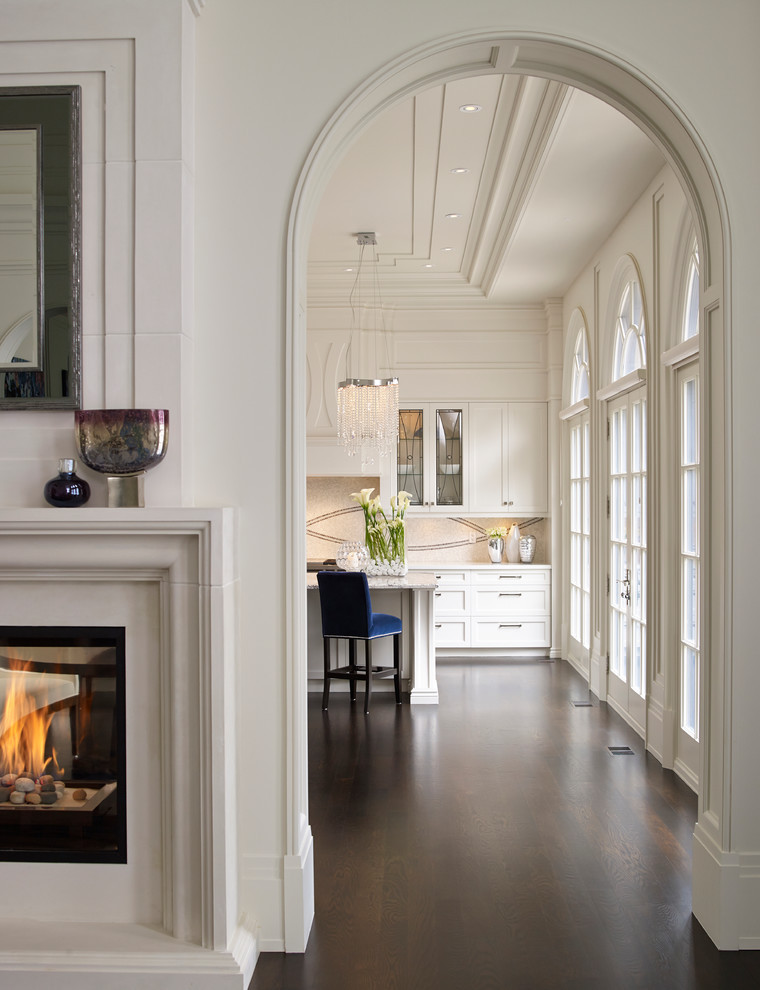 Inspiration for a large transitional single-wall dark wood floor eat-in kitchen remodel in Toronto with marble countertops, mosaic tile backsplash, an island, a double-bowl sink, shaker cabinets, white backsplash and paneled appliances