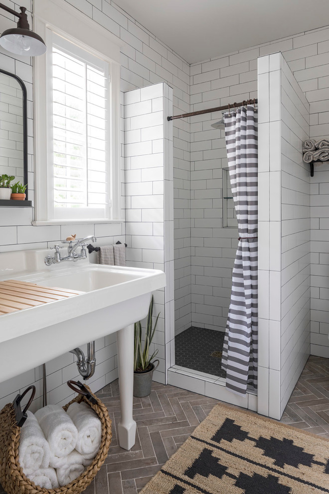 Design ideas for a large beach style master bathroom in Minneapolis with an alcove shower, white tile, subway tile, a console sink, grey floor, a shower curtain, white walls, porcelain floors and solid surface benchtops.