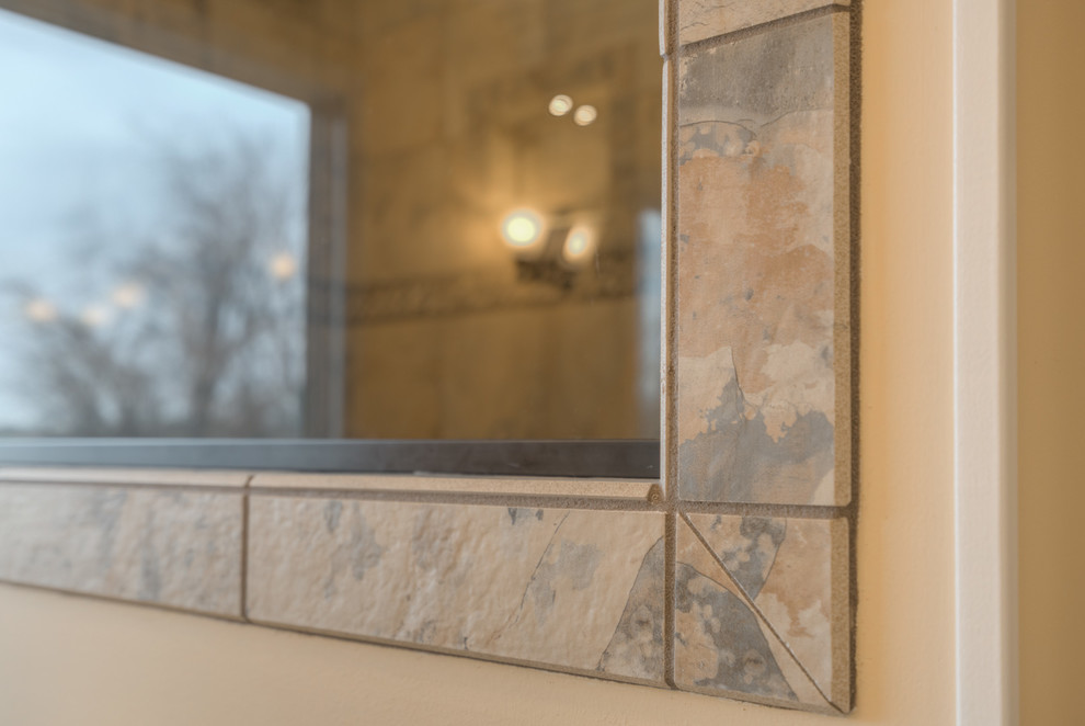 Home design - mid-sized transitional master multicolored tile ceramic tile home design idea with raised-panel cabinets, beige cabinets, a two-piece toilet, beige walls, an undermount sink and quartz countertops