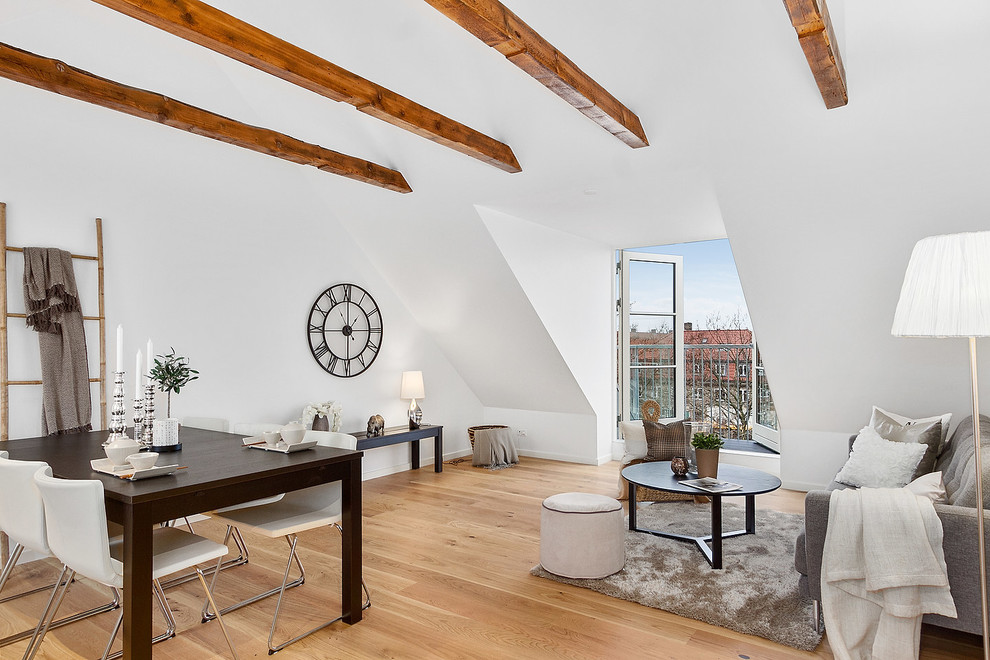 Design ideas for a scandinavian living room in Copenhagen with white walls, medium hardwood floors and brown floor.