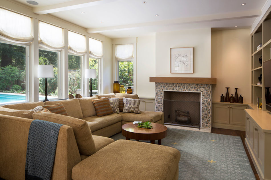 Photo of a mid-sized contemporary enclosed family room in San Francisco with a game room, white walls, medium hardwood floors, a standard fireplace, a tile fireplace surround and a built-in media wall.
