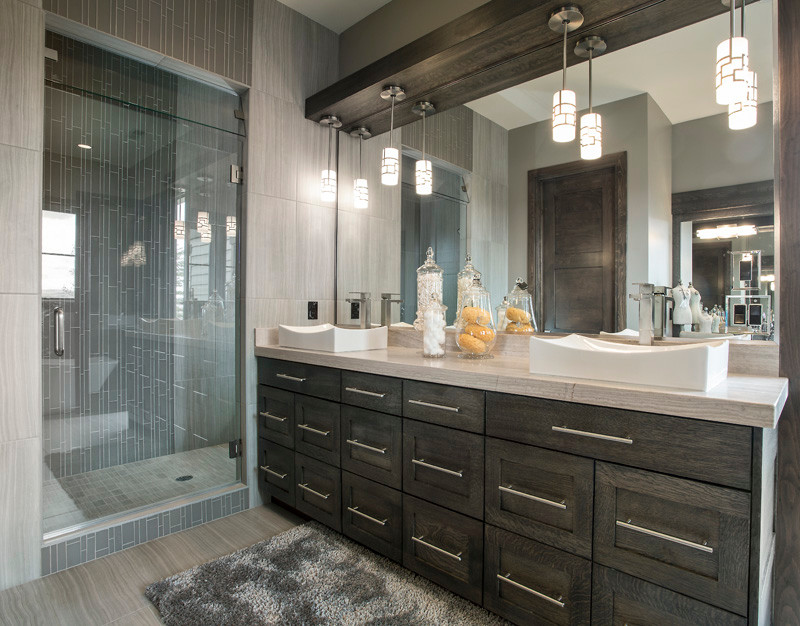 This is an example of a large country bathroom in Salt Lake City with recessed-panel cabinets, grey cabinets, a freestanding tub, an alcove shower, a two-piece toilet, gray tile, ceramic tile, grey walls, ceramic floors, a pedestal sink and granite benchtops.