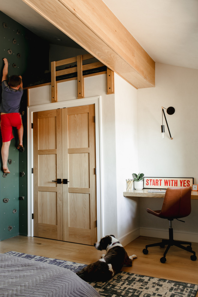 Inspiration for a mid-sized rustic light wood floor kids' room remodel in Denver