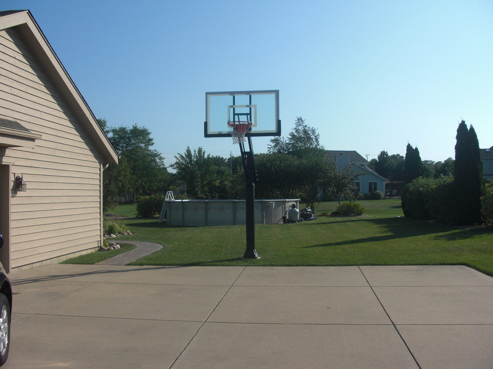 Design ideas for a large traditional backyard partial sun outdoor sport court in Milwaukee.
