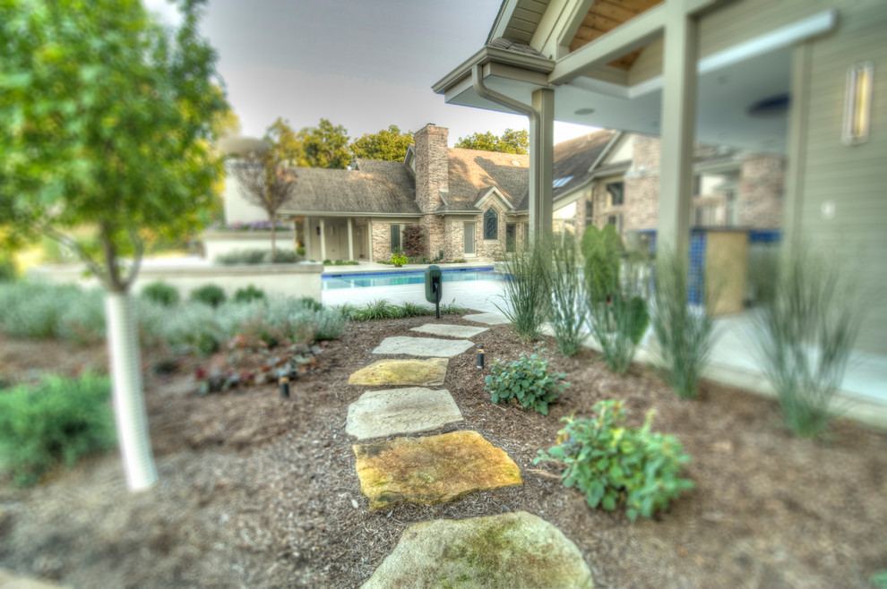Hot tub - large transitional backyard concrete paver and rectangular natural hot tub idea in Cedar Rapids