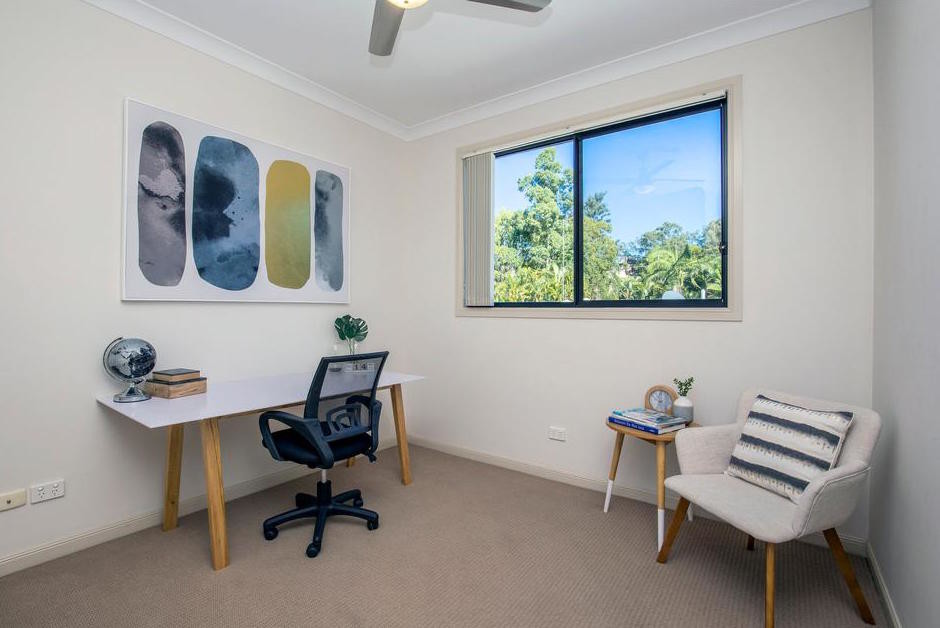 Inspiration for a mid-sized contemporary study room in Gold Coast - Tweed with white walls, carpet, a freestanding desk and beige floor.